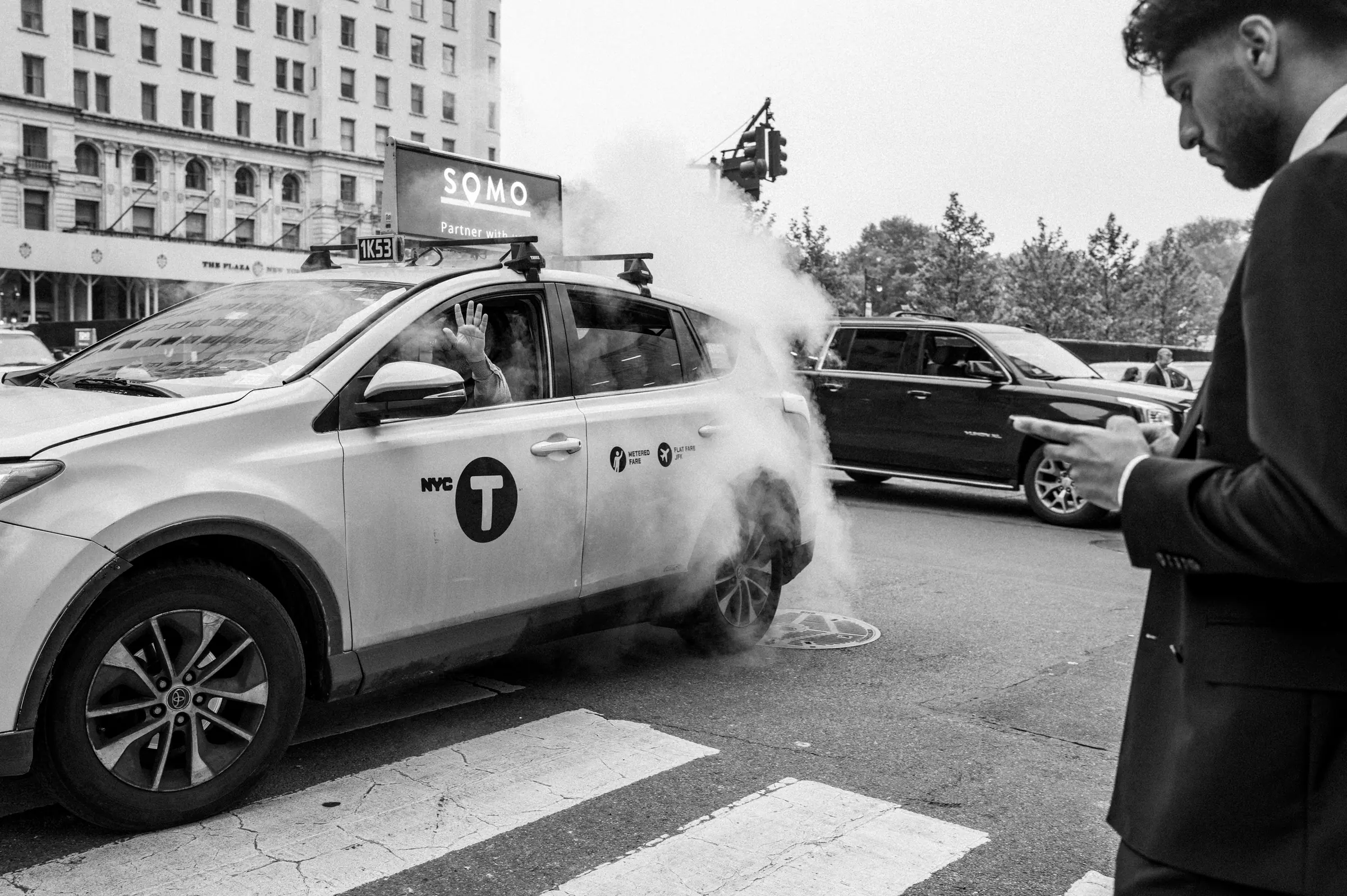 Yellow cab in steam on a New York street